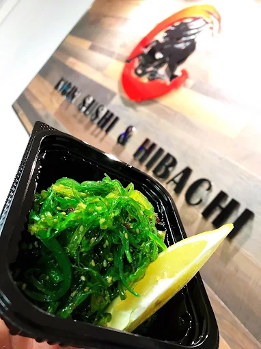 Seaweed salad with a slice of lemon